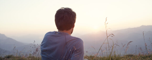 Person meditating at sunrise in nature, representing mindfulness skills taught in Dialectical Behavior Therapy (DBT) at Pathways Counseling Services in Scottsdale, AZ