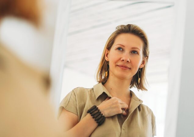 Dialectical behavior treatment scottsdale az Woman calmly looking at herself in the mirror, symbolizing emotional regulation and self awareness developed through DBT therapy in scottsdale az