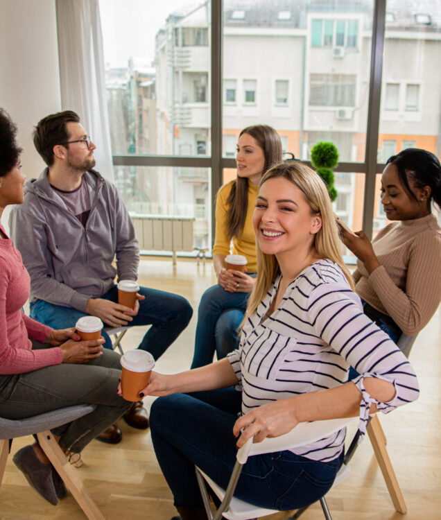 Group Therapy in Scottsdale AZ | Pathways Counseling Services group therapy session in Scottsdale AZ with therapist guiding group discussion at Pathways Counseling Services