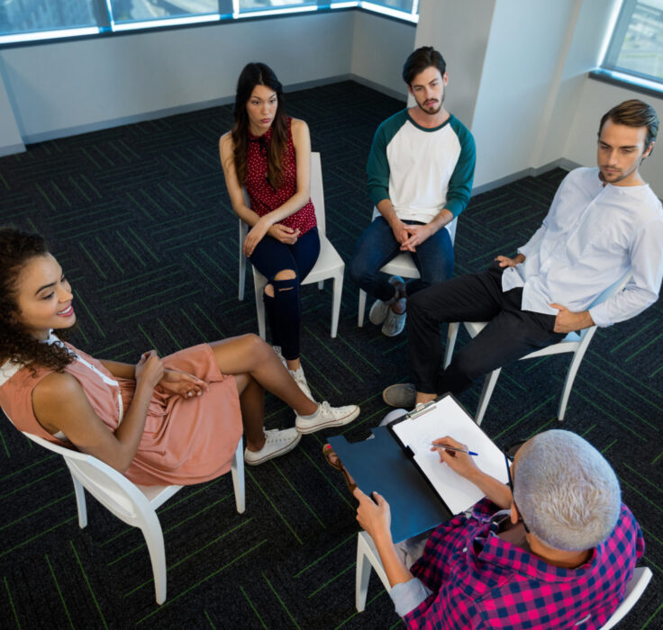 Group Therapy in Scottsdale AZ | Pathways Counseling Services group therapy session in Scottsdale AZ with therapist guiding group discussion at Pathways Counseling Services