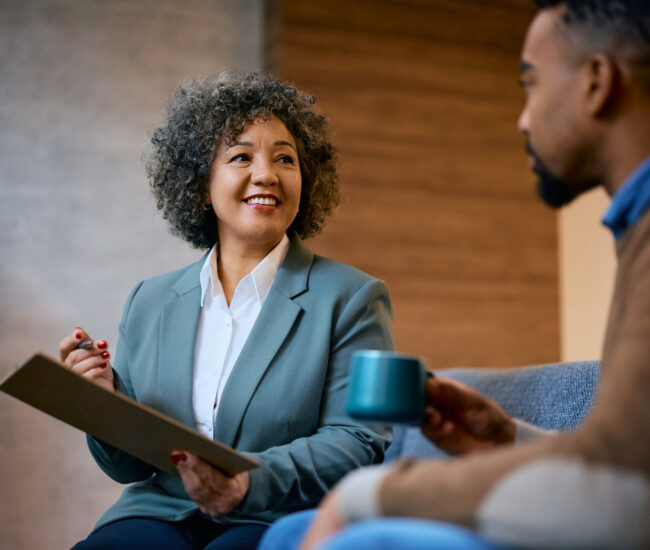 Cognitive Behavioral Therapy in Scottsdale AZ | Pathways Counseling Services cognitive behavioral therapy session in Scottsdale AZ with therapist explaining strategies to client at Pathways Counseling Services