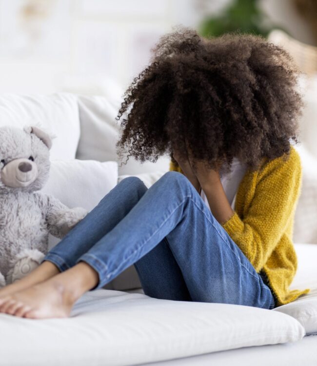 Child experiencing depression and emotional withdrawal during therapy support in Scottsdale AZ