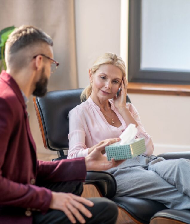 Couples counseling session in Scottsdale AZ with therapist guiding conversation between partners