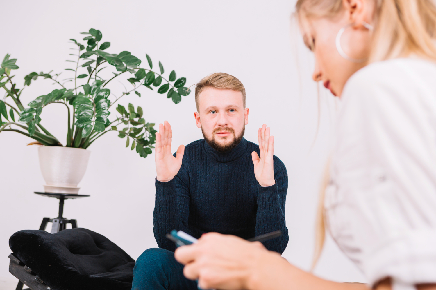 man gesture with hands in therapy