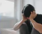 Person sitting alone with their head in their hands, representing anxiety, emotional distress, and feelings of overwhelm.