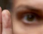 Close-up of a person following finger movements with their eyes, representing bilateral stimulation used during EMDR therapy.