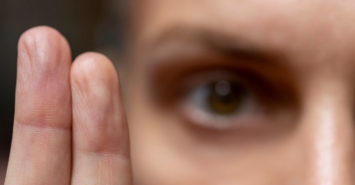 Close-up of a person following finger movements with their eyes, representing bilateral stimulation used during EMDR therapy.