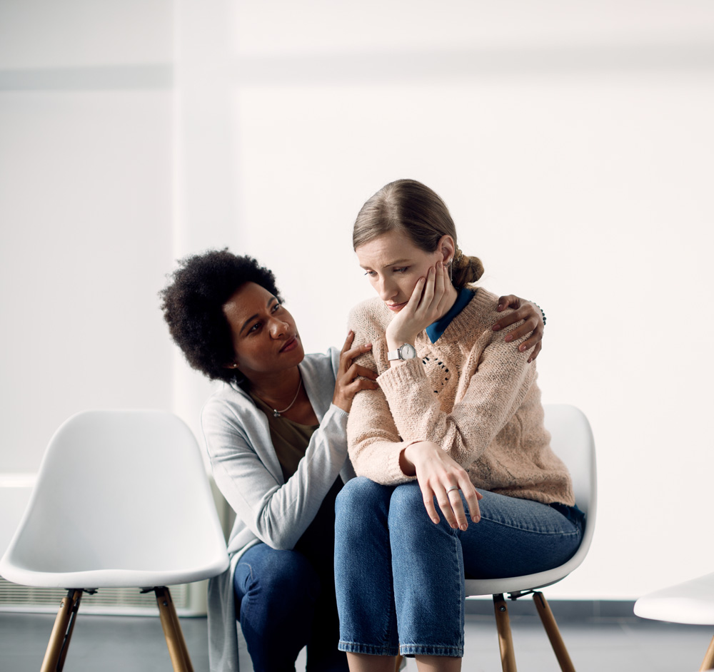 woman consoling sad woman