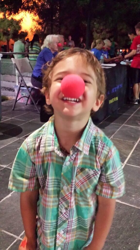 ADHD child - Little boy with red nose and smiling at camera